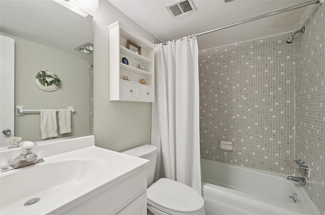 7304 W Country Club Dr N Unit 113, Sarasota, FL 34243 - full bathroom featuring vanity, shower / bath combo with shower curtain, and toilet