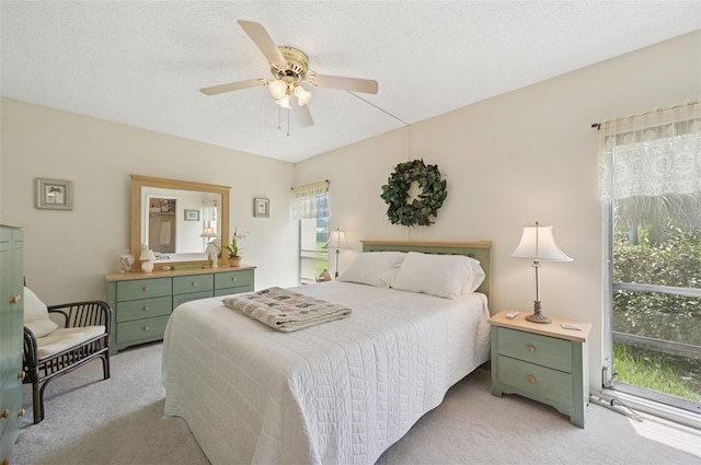 7304 W Country Club Dr N Unit 113, Sarasota, FL 34243 - bedroom with light carpet and a ceiling fan