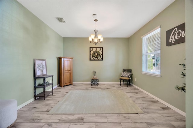 5624 Fisher Glen Loop, Wesley Chapel, FL 33545 - living area with wood finished floors, a chandelier, and baseboards