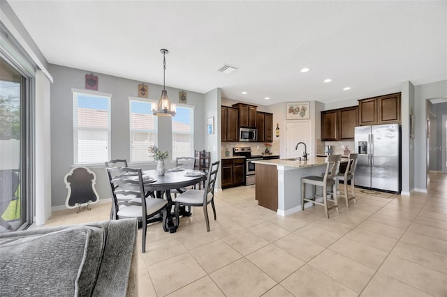 5624 Fisher Glen Loop, Wesley Chapel, FL 33545 - dining area featuring light tile patterned floors, baseboards, a chandelier, and recessed lighting