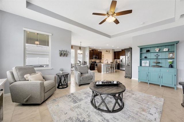 5624 Fisher Glen Loop, Wesley Chapel, FL 33545 - living area with a raised ceiling, a ceiling fan, light tile patterned floors, baseboards, and recessed lighting