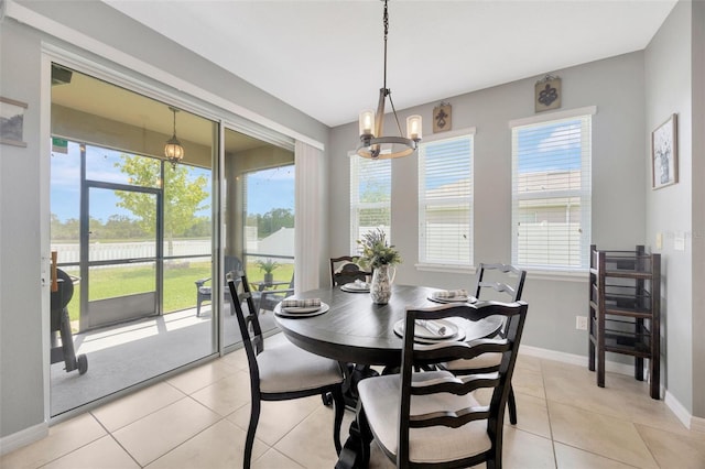 5624 Fisher Glen Loop, Wesley Chapel, FL 33545 - dining space with plenty of natural light, a water view, and light tile patterned floors