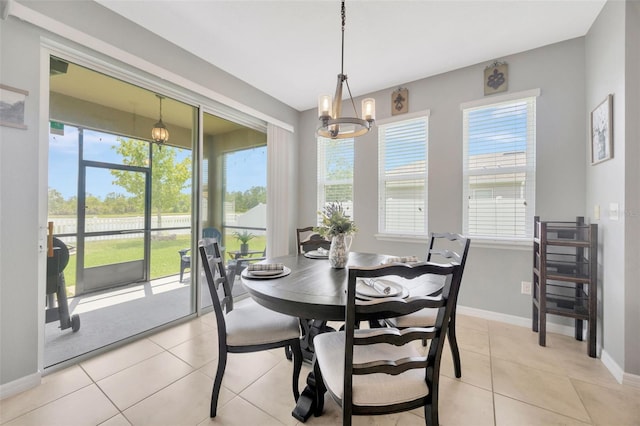 5624 Fisher Glen Loop, Wesley Chapel, FL 33545 - dining area featuring healthy amount of natural light, baseboards, and light tile patterned flooring