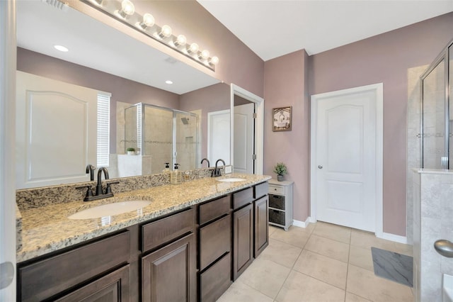 5624 Fisher Glen Loop, Wesley Chapel, FL 33545 - full bath with a shower stall, tile patterned flooring, double vanity, and baseboards