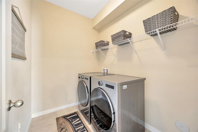 5624 Fisher Glen Loop, Wesley Chapel, FL 33545 - laundry room featuring independent washer and dryer, baseboards, and light tile patterned floors