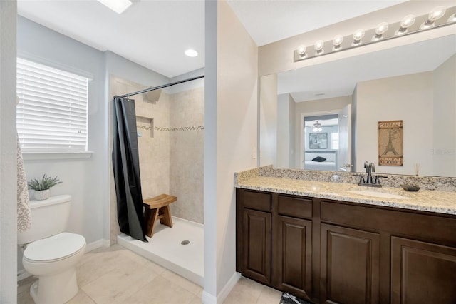 5624 Fisher Glen Loop, Wesley Chapel, FL 33545 - bathroom with vanity, toilet, tile patterned floors, tiled shower, and baseboards