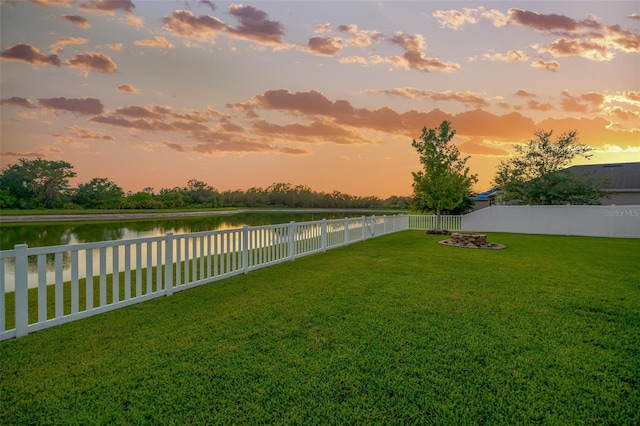 5624 Fisher Glen Loop, Wesley Chapel, FL 33545 - yard at dusk featuring a water view