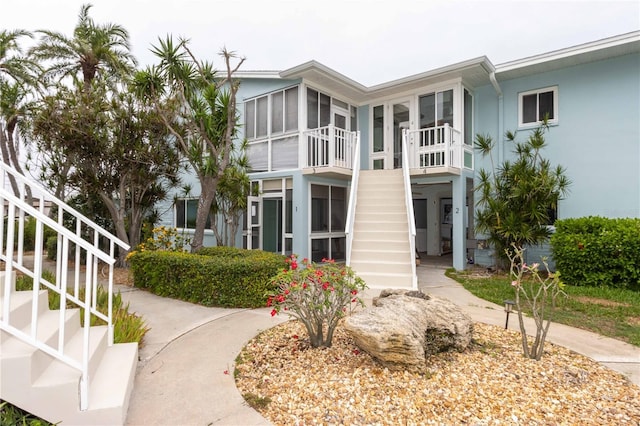 241 Skiff Pt Unit 1, Clearwater Beach, FL 33767 - view of property featuring stairway