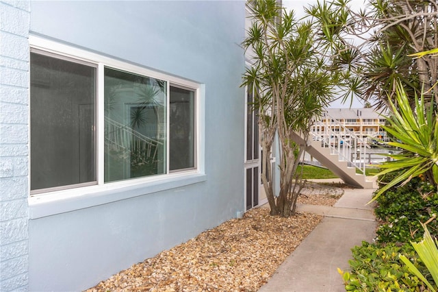 241 Skiff Pt Unit 1, Clearwater Beach, FL 33767 - view of exterior entry featuring stucco siding