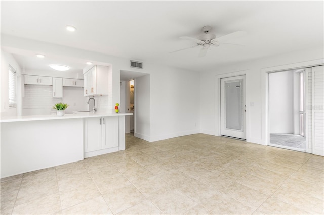 241 Skiff Pt Unit 1, Clearwater Beach, FL 33767 - unfurnished living room featuring a sink, ceiling fan, recessed lighting, and baseboards