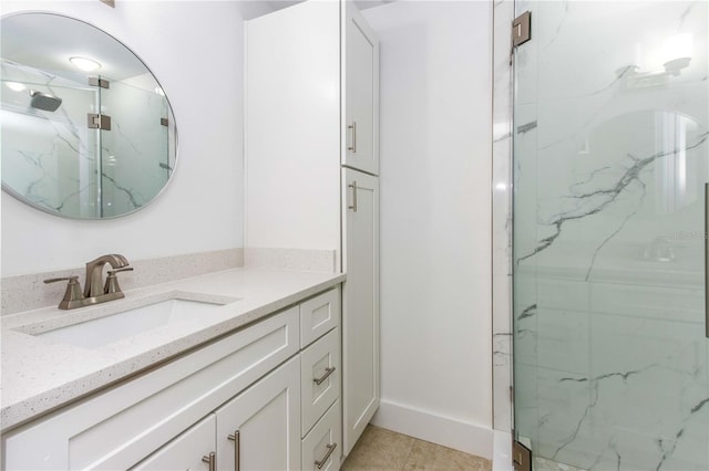 241 Skiff Pt Unit 1, Clearwater Beach, FL 33767 - full bath featuring a marble finish shower, vanity, and tile patterned flooring
