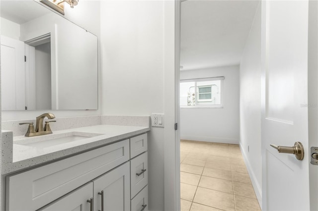 241 Skiff Pt Unit 1, Clearwater Beach, FL 33767 - bathroom featuring vanity, tile patterned floors, and baseboards