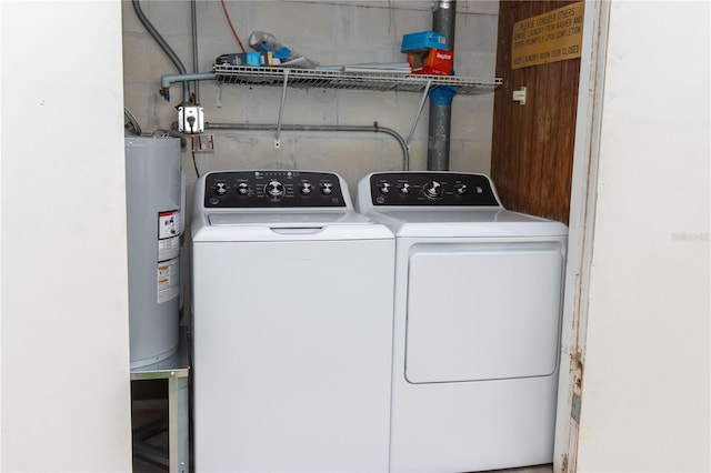 241 Skiff Pt Unit 1, Clearwater Beach, FL 33767 - washroom featuring separate washer and dryer and water heater