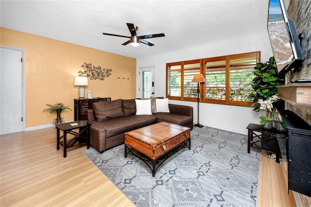 614 12th St NW, Largo, FL 33770 - living area with ceiling fan and wood finished floors