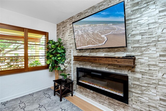 614 12th St NW, Largo, FL 33770 - detailed view of a glass covered fireplace and wood finished floors