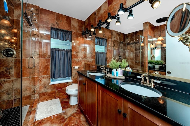 614 12th St NW, Largo, FL 33770 - bathroom with tile walls, a stall shower, and double vanity