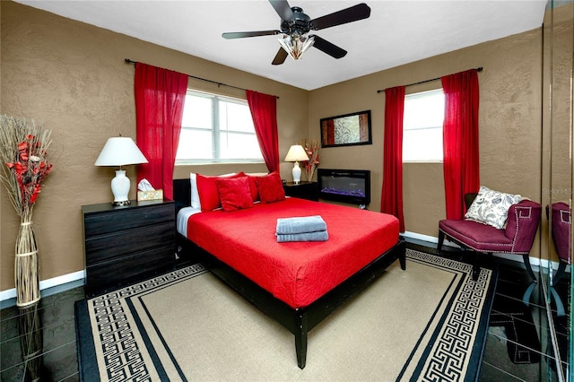 614 12th St NW, Largo, FL 33770 - bedroom with a ceiling fan and a textured wall