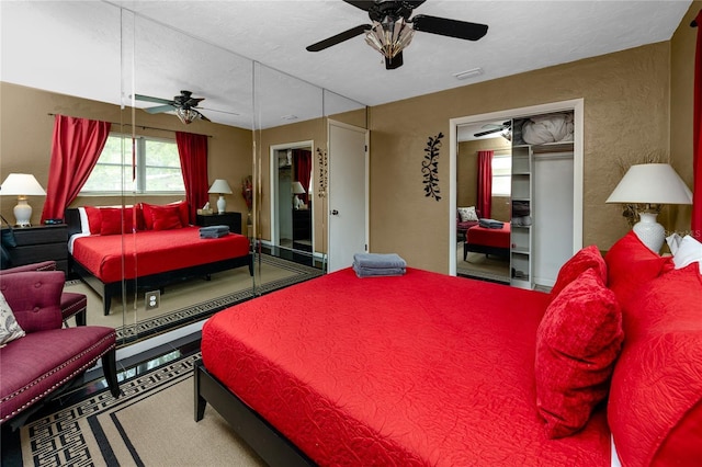 614 12th St NW, Largo, FL 33770 - bedroom with ceiling fan, a closet, and a textured wall