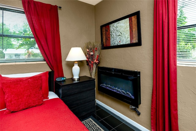 614 12th St NW, Largo, FL 33770 - tiled bedroom featuring a textured wall