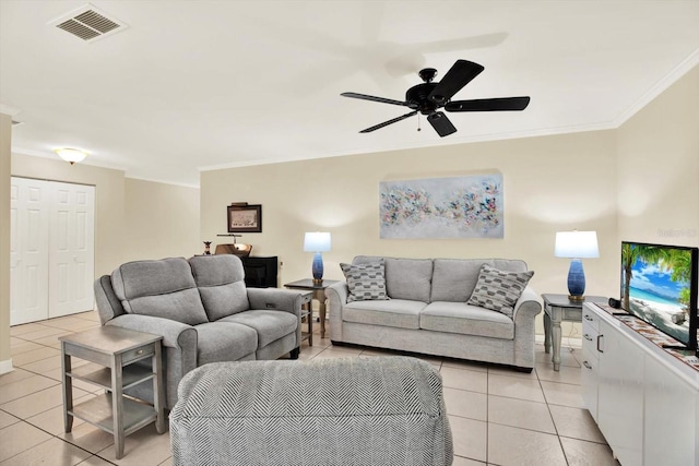 5501 80th St N Unit 206, Saint Petersburg, FL 33709 - living area with light tile patterned flooring, crown molding, and ceiling fan