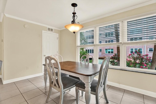 5501 80th St N Unit 206, Saint Petersburg, FL 33709 - dining space featuring crown molding and light tile patterned floors
