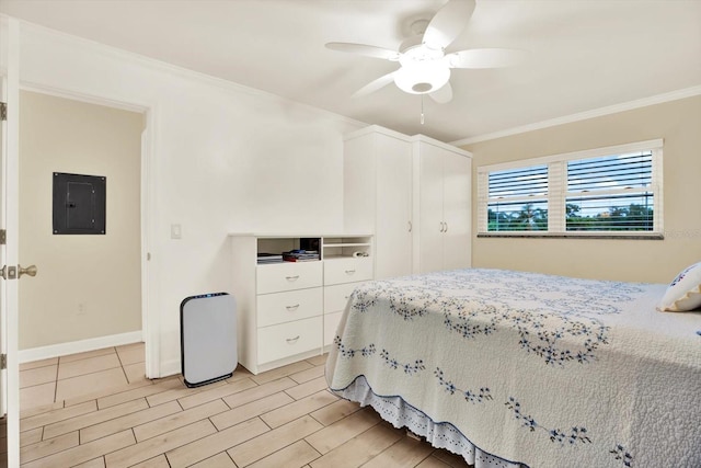 5501 80th St N Unit 206, Saint Petersburg, FL 33709 - bedroom with electric panel, ornamental molding, ceiling fan, and wood finish floors