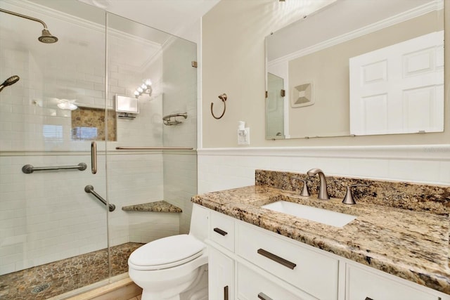 5501 80th St N Unit 206, Saint Petersburg, FL 33709 - full bath with vanity, a stall shower, wainscoting, crown molding, and tile walls