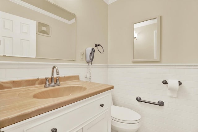 5501 80th St N Unit 206, Saint Petersburg, FL 33709 - half bathroom with vanity, tile walls, a wainscoted wall, and ornamental molding