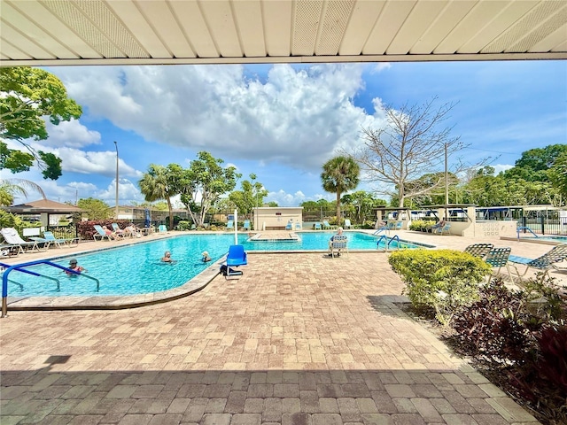 5501 80th St N Unit 206, Saint Petersburg, FL 33709 - community pool featuring a patio area