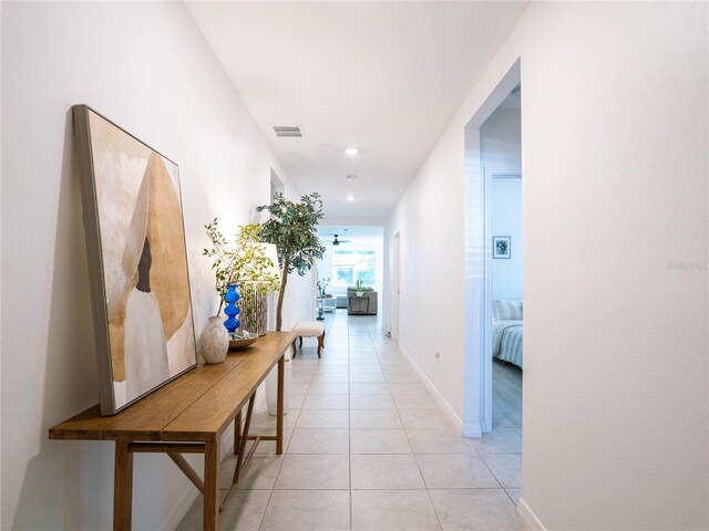 573 Vista Villages Blvd, Davenport, FL 33896 - hall featuring light tile patterned flooring, baseboards, and recessed lighting