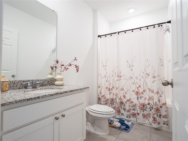 573 Vista Villages Blvd, Davenport, FL 33896 - bathroom featuring vanity, tile patterned flooring, toilet, and shower / bath combo