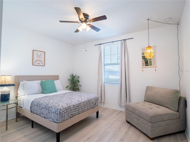 573 Vista Villages Blvd, Davenport, FL 33896 - bedroom with light wood finished floors, baseboards, and a ceiling fan