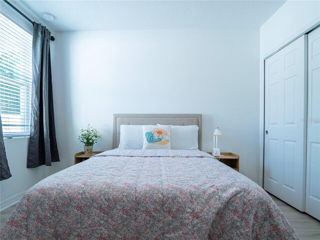 573 Vista Villages Blvd, Davenport, FL 33896 - bedroom with light wood finished floors