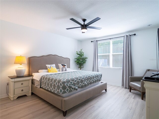 573 Vista Villages Blvd, Davenport, FL 33896 - bedroom featuring light wood-style floors, baseboards, and ceiling fan