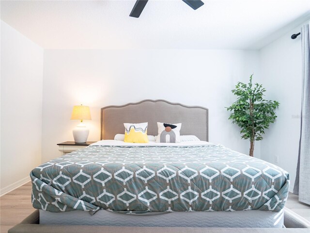 573 Vista Villages Blvd, Davenport, FL 33896 - bedroom with light wood-style flooring, baseboards, and ceiling fan