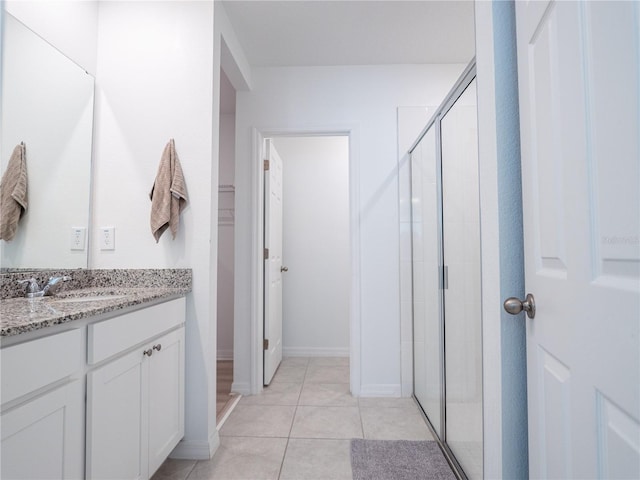 573 Vista Villages Blvd, Davenport, FL 33896 - full bath featuring vanity, a shower stall, and tile patterned flooring
