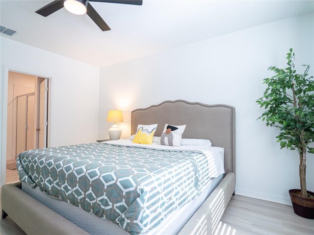 573 Vista Villages Blvd, Davenport, FL 33896 - bedroom featuring wood finished floors, baseboards, and a ceiling fan