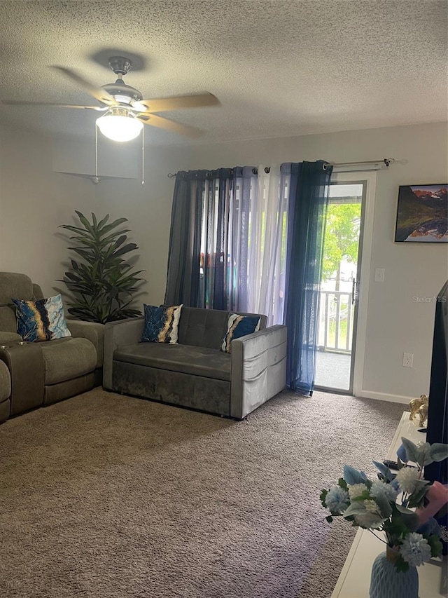 3802 Cortez Cir Unit D, Tampa, FL 33614 - carpeted living room featuring a textured ceiling and ceiling fan