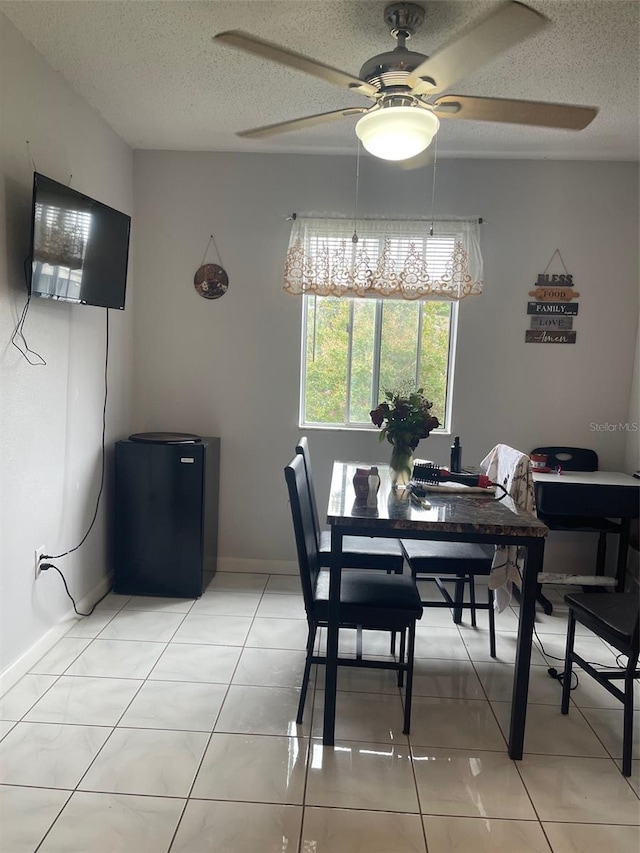 3802 Cortez Cir Unit D, Tampa, FL 33614 - dining space featuring ceiling fan, a textured ceiling, and light tile patterned floors