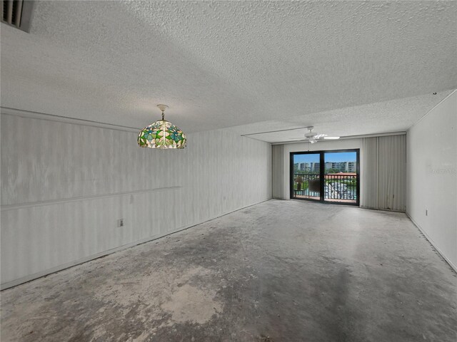 7600 Sun Island Dr S Unit 603, South Pasadena, FL 33707 - unfurnished room with concrete flooring, a textured ceiling, and ceiling fan