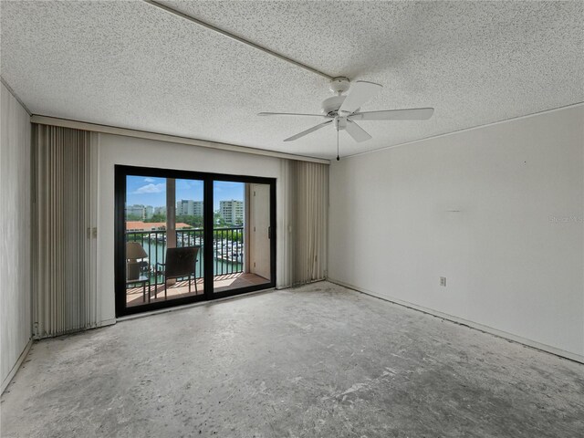 7600 Sun Island Dr S Unit 603, South Pasadena, FL 33707 - empty room with ceiling fan and a textured ceiling