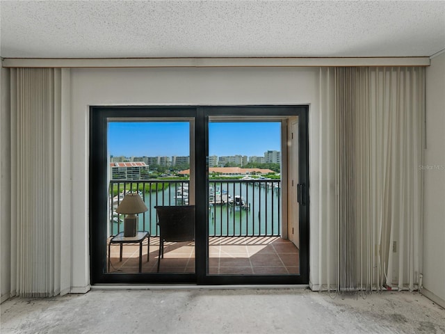 7600 Sun Island Dr S Unit 603, South Pasadena, FL 33707 - doorway to outside with plenty of natural light and a water view