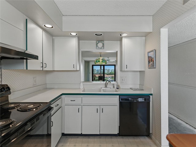 7600 Sun Island Dr S Unit 603, South Pasadena, FL 33707 - kitchen with black appliances, light countertops, white cabinetry, under cabinet range hood, and wallpapered walls