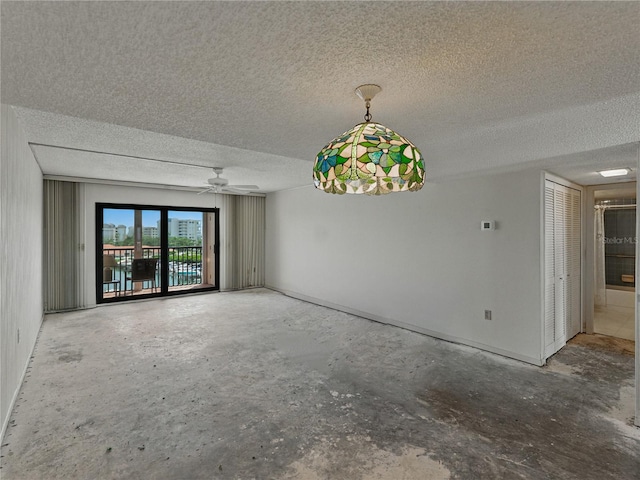 7600 Sun Island Dr S Unit 603, South Pasadena, FL 33707 - empty room featuring a textured ceiling, unfinished concrete flooring, and ceiling fan