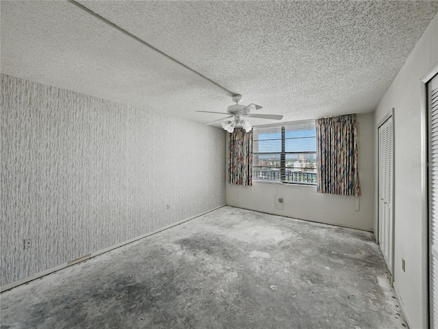 7600 Sun Island Dr S Unit 603, South Pasadena, FL 33707 - unfurnished bedroom with concrete flooring, a textured ceiling, and a ceiling fan