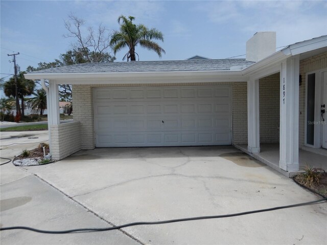 1897 Dolphin Blvd S, Saint Petersburg, FL 33707 - garage featuring driveway