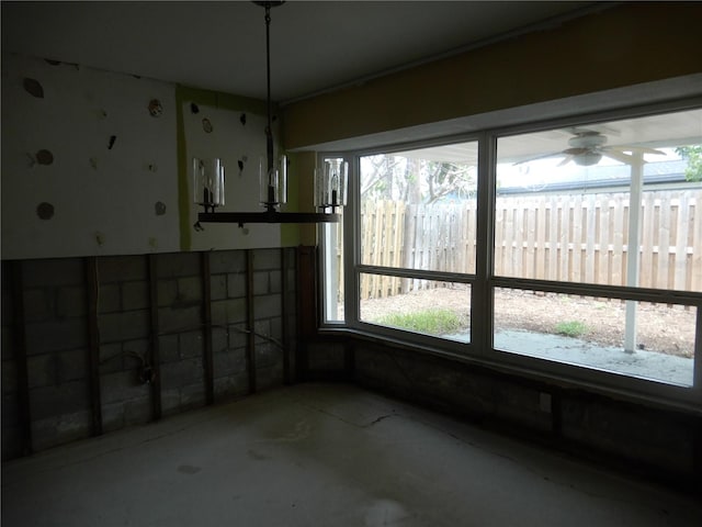 1897 Dolphin Blvd S, Saint Petersburg, FL 33707 - unfurnished dining area featuring plenty of natural light, concrete flooring, and a ceiling fan