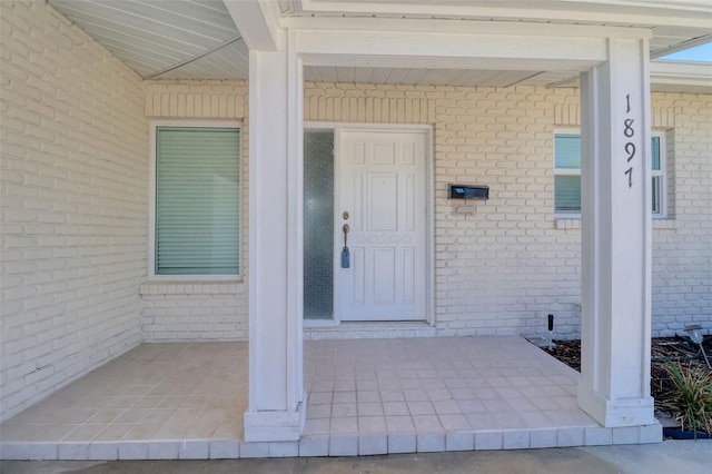 1897 Dolphin Blvd S, Saint Petersburg, FL 33707 - view of exterior entry featuring brick siding and covered porch