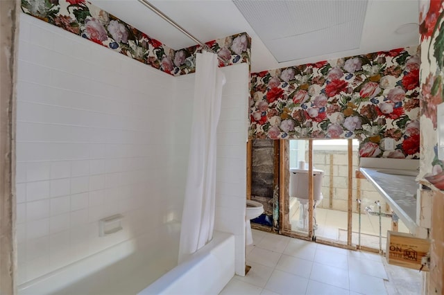 1897 Dolphin Blvd S, Saint Petersburg, FL 33707 - full bathroom featuring wallpapered walls, shower / bath combo with shower curtain, vanity, and tile patterned floors