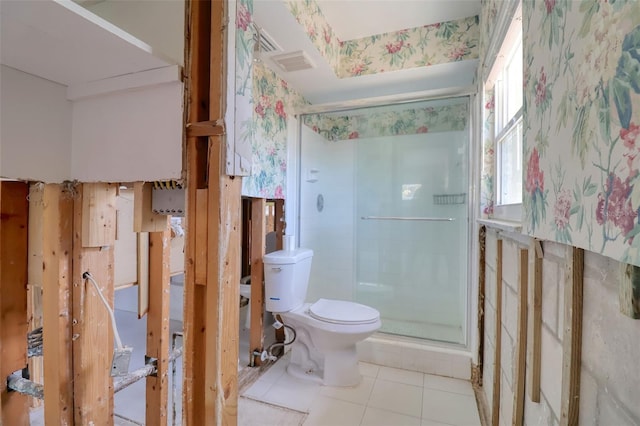 1897 Dolphin Blvd S, Saint Petersburg, FL 33707 - bathroom with a shower stall, tile patterned floors, and wallpapered walls
